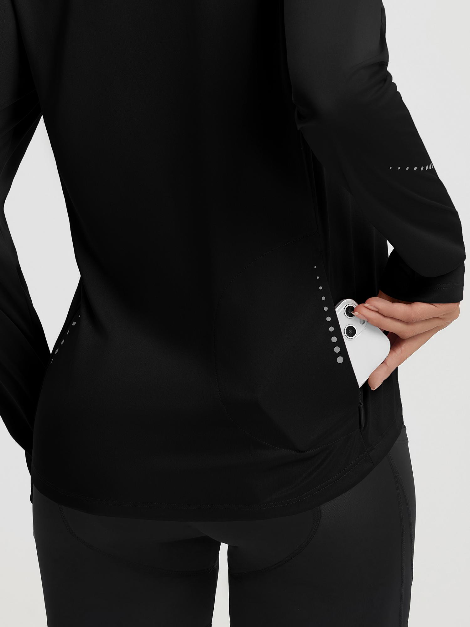 Women's black half zip cycling jersey with hidden phone pocket and reflective details. #color_Black