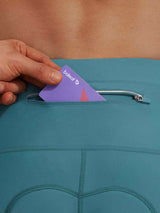 Teal Baleaf bike shorts with zippered pocket holding a Baleaf card. #color_Teal Green