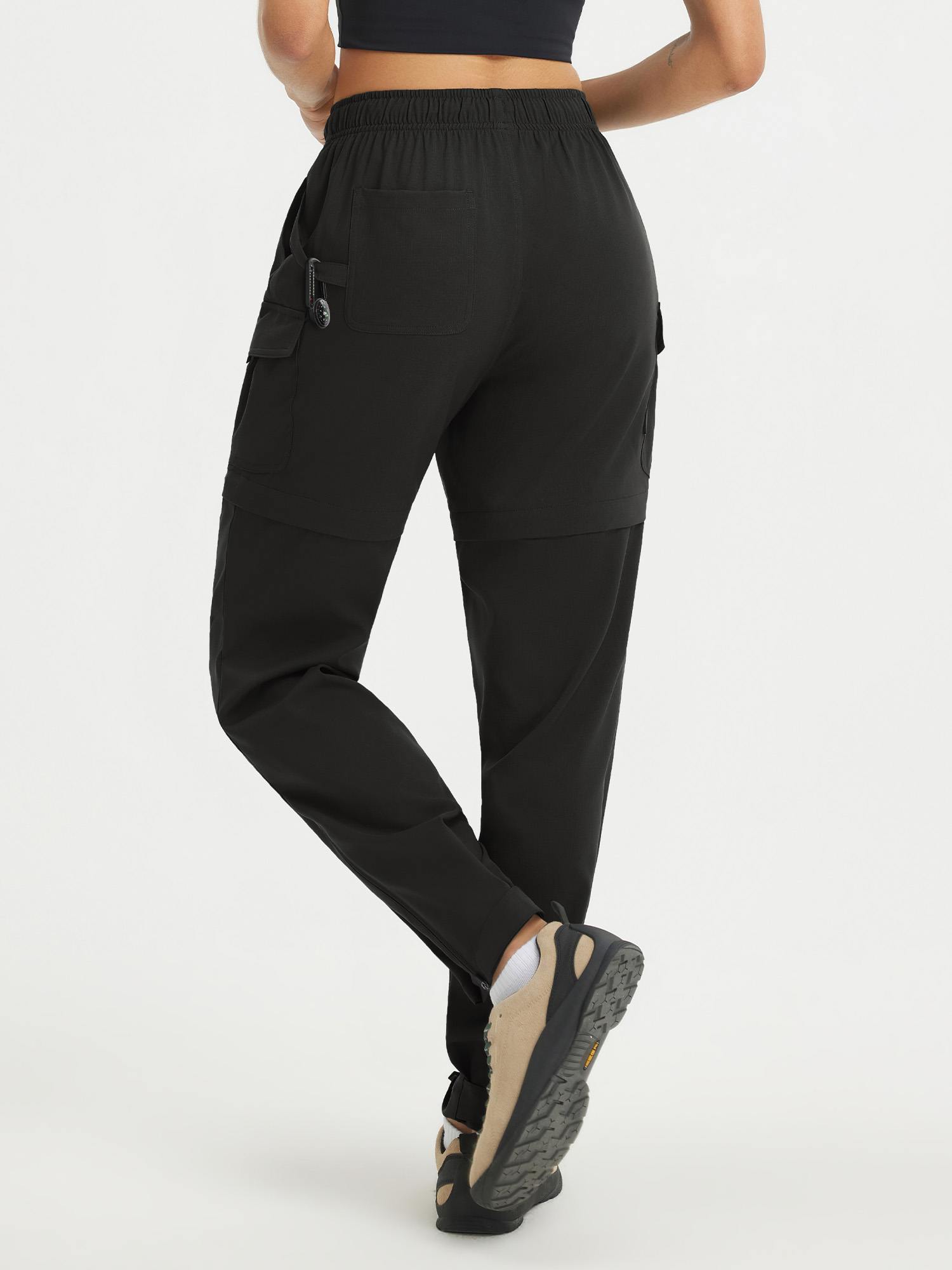 Baleaf black UPF 50+ convertible zip-off hiking pants, back view. #color_Black