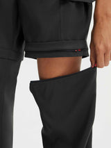 Black Baleaf convertible hiking pants with zipper detail converting to shorts. #color_Black
