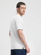 Man wearing white Baleaf UPF 50+ quick-dry V-neck t-shirt, looking over shoulder. #color_White