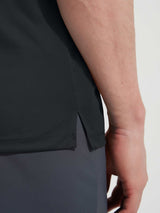 Dark grey Baleaf UPF 50+ shirt hem with athletic side slit. #color_Black