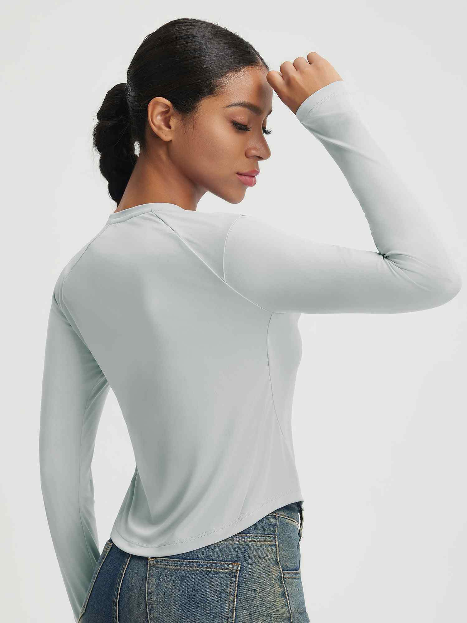 Light grey Baleaf UPF 50+ long-sleeve crop shirt with crew neck and slim fit, shown on a woman. #color_Light Gray