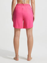 Baleaf women's pink 7'' UPF 50+ high-rise board shorts with elastic waist and side pockets. #color_Hot Pink