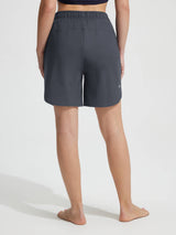 Baleaf women's 7'' board shorts: charcoal grey, high-rise waist, side pockets, quick-drying UPF 50+ fabric. #color_Dark Gray