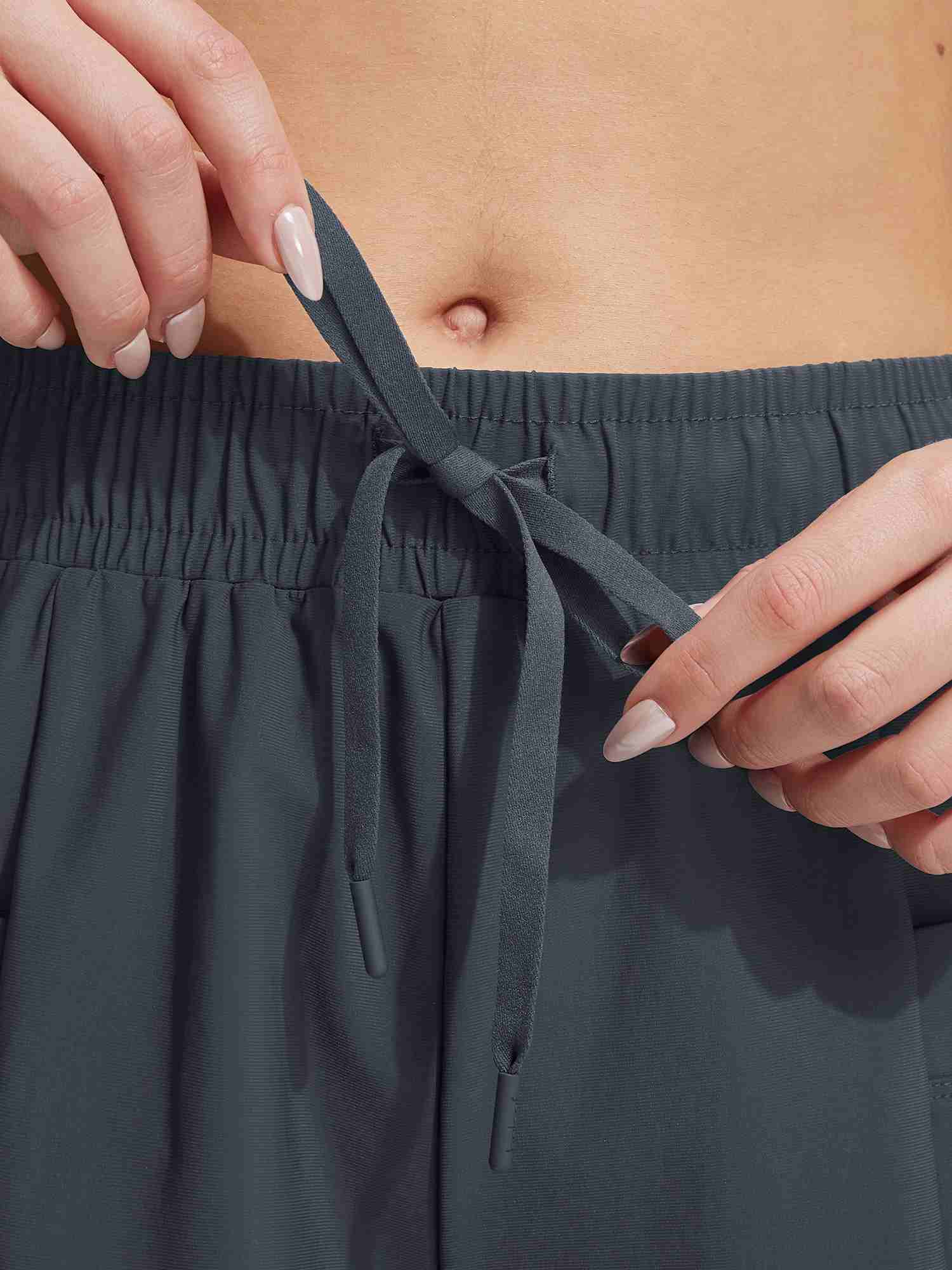 Baleaf 7'' UPF 50+ high-rise board shorts with drawstring detail. #color_Dark Gray