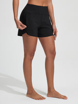 Baleaf black 7'' high-rise board shorts with UPF 50+ and secure side zipper pockets.