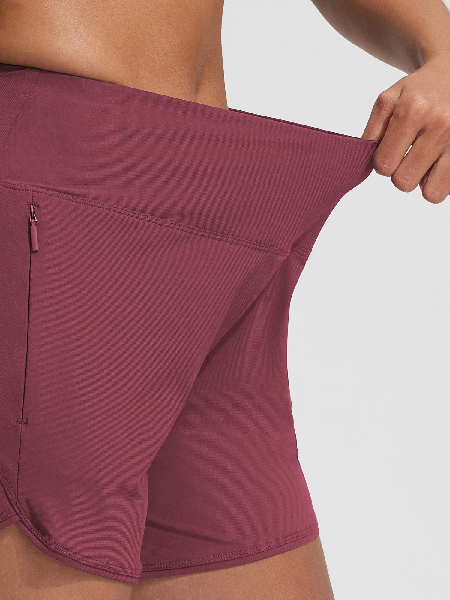 Maroon Baleaf UPF 50+ 7'' high-rise board shorts with secure zipper pocket.