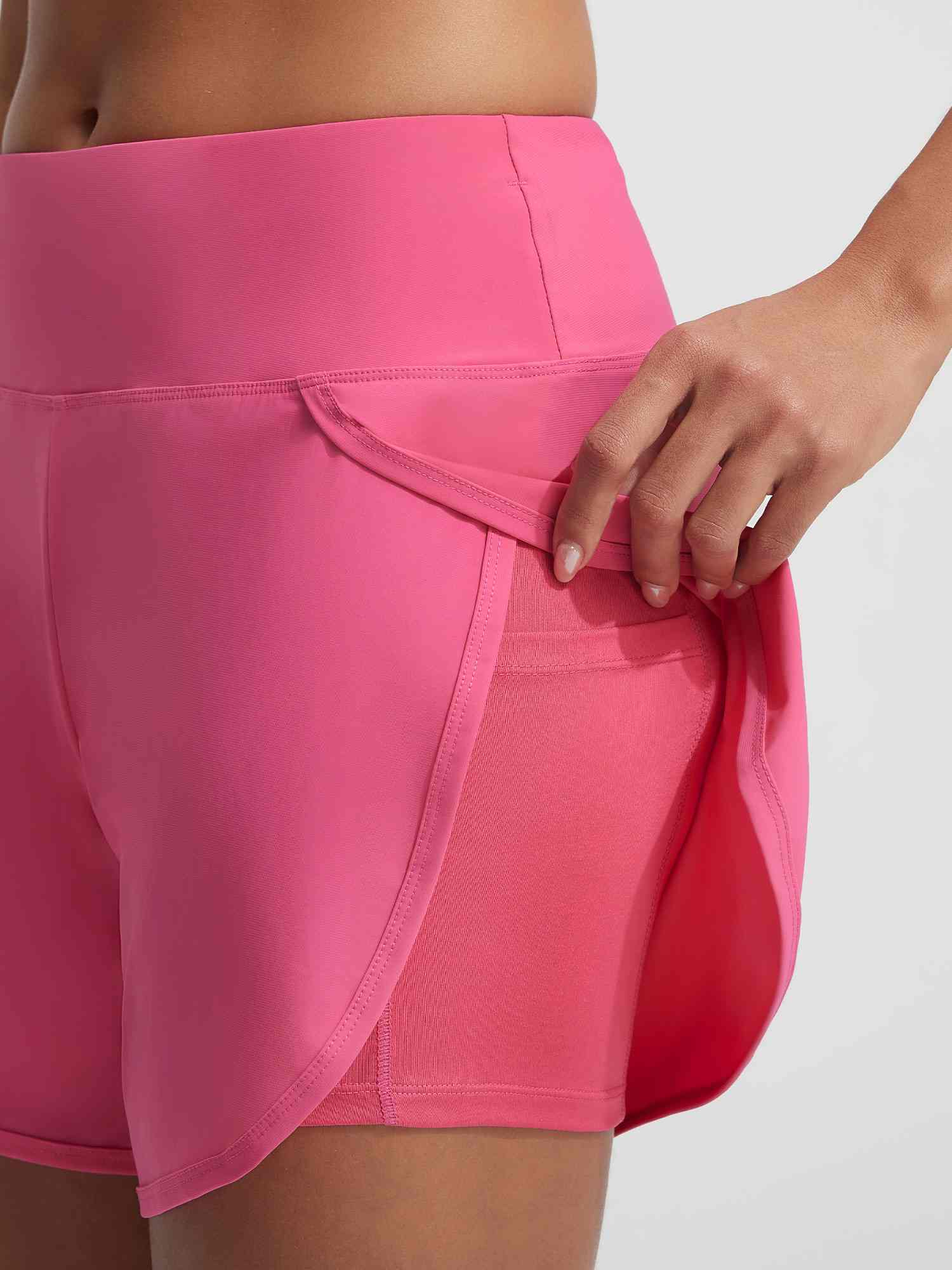 Pink UPF50+ 2-in-1 swim shorts with built-in liner and accessible side pocket. #color_Hot Pink