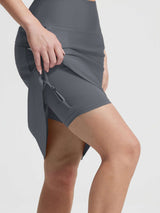 Grey Baleaf UPF 50+ high-rise swim skirt with attached capri leggings showing slant pockets. #color_Dark Gray