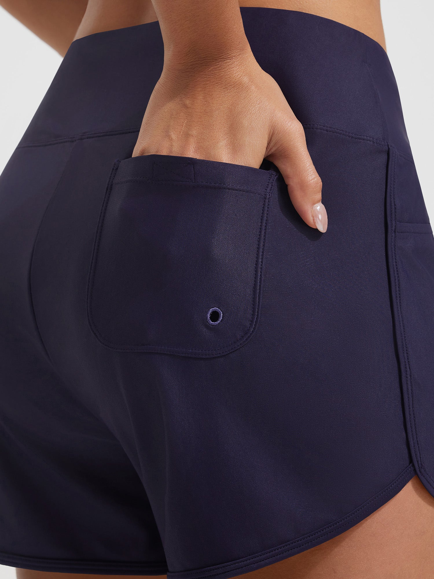 Baleaf UPF 50+ navy high-rise board shorts with 3 pockets, hand in side pocket. #color_Navy