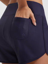 Baleaf UPF 50+ navy high-rise board shorts with 3 pockets, hand in side pocket. #color_Navy