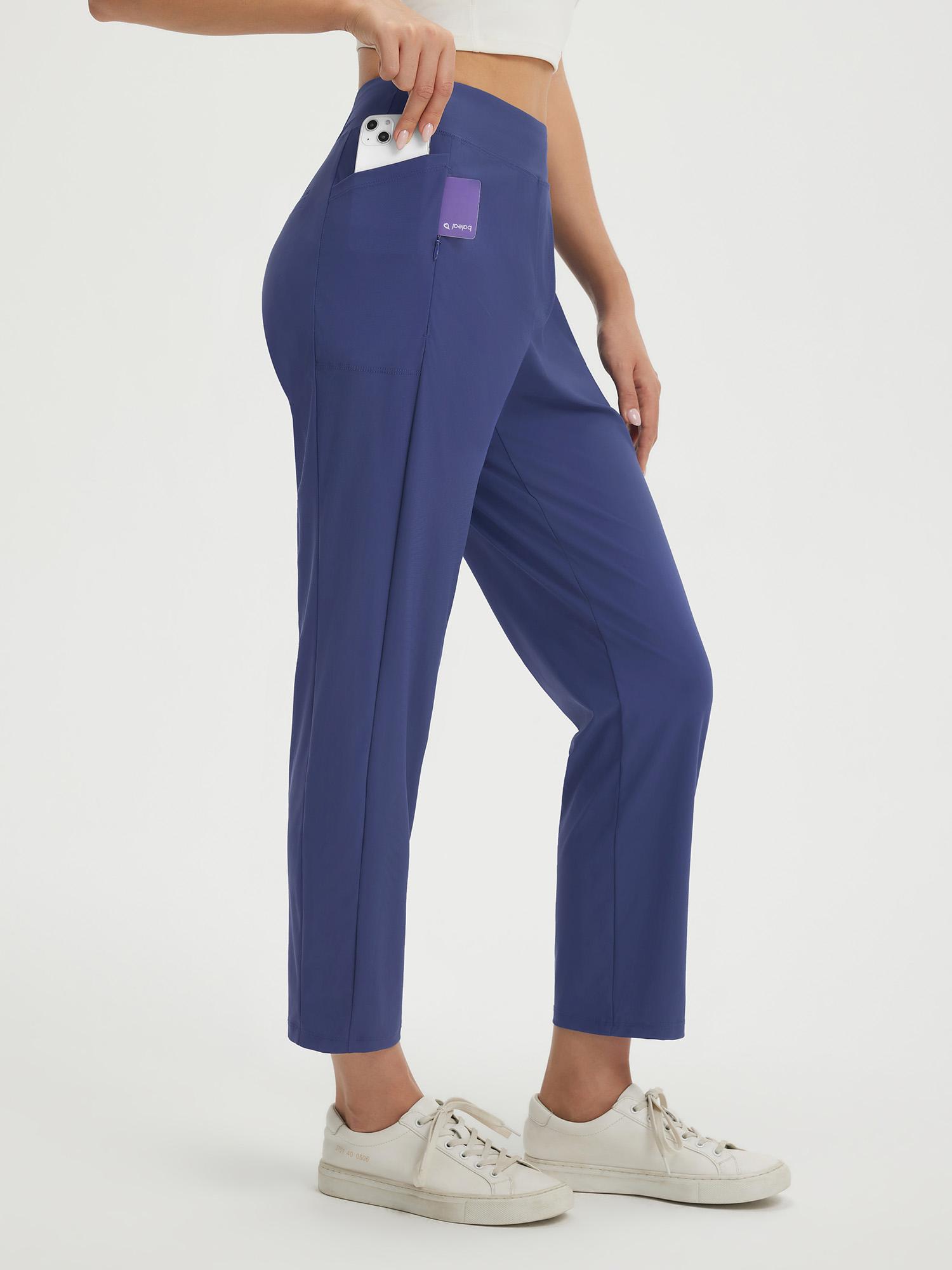 Petite navy blue 25" ankle length pull on travel pants with b&oy logo pocket. #color_Navy Blue