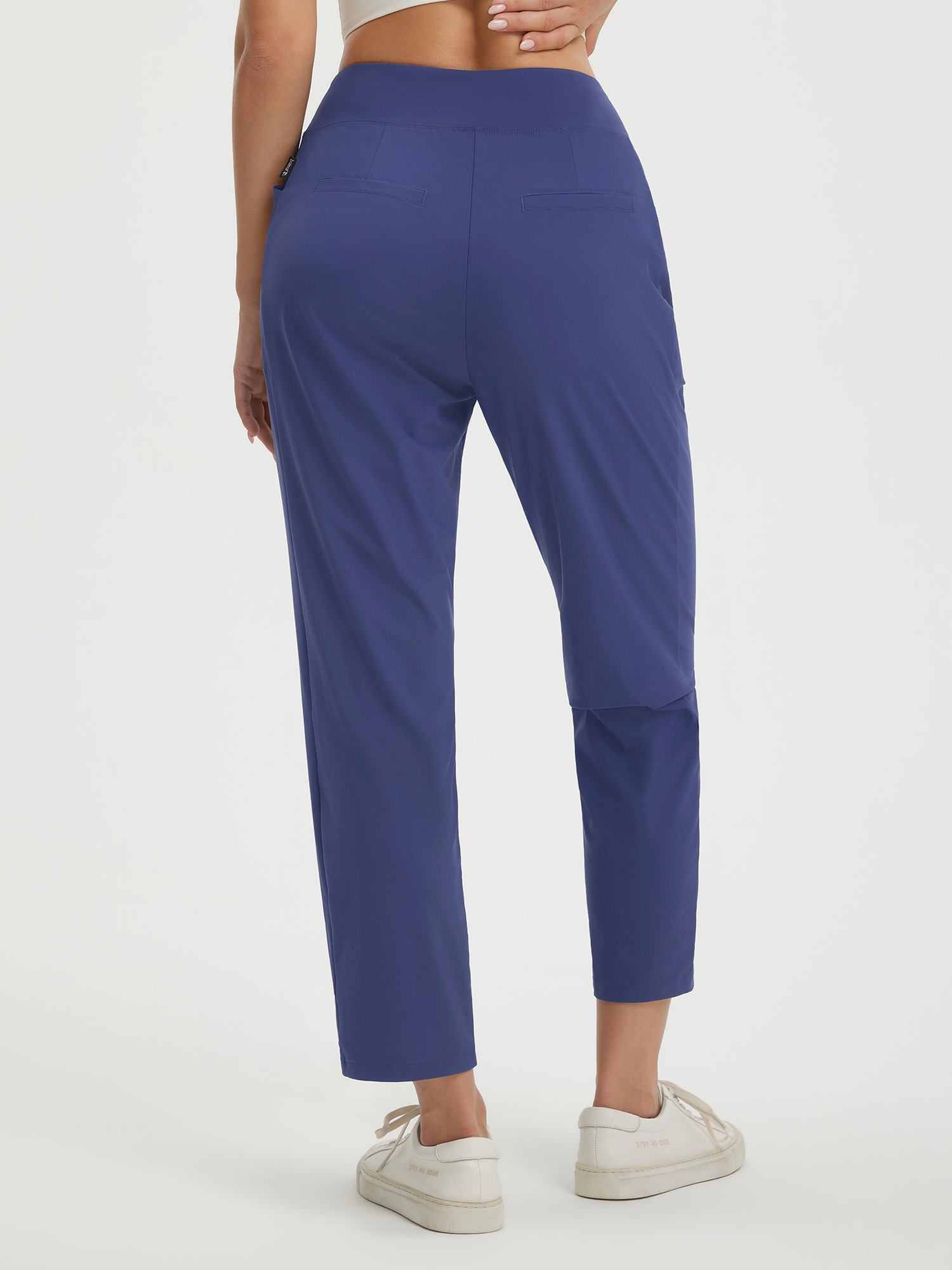 Navy blue petite 25-inch ankle length pull on travel pants with faux fly and pockets #color_Navy Blue