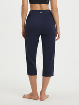 Baleaf women's navy stretchy high-rise capri 21", straight leg, back view. #color_Navy