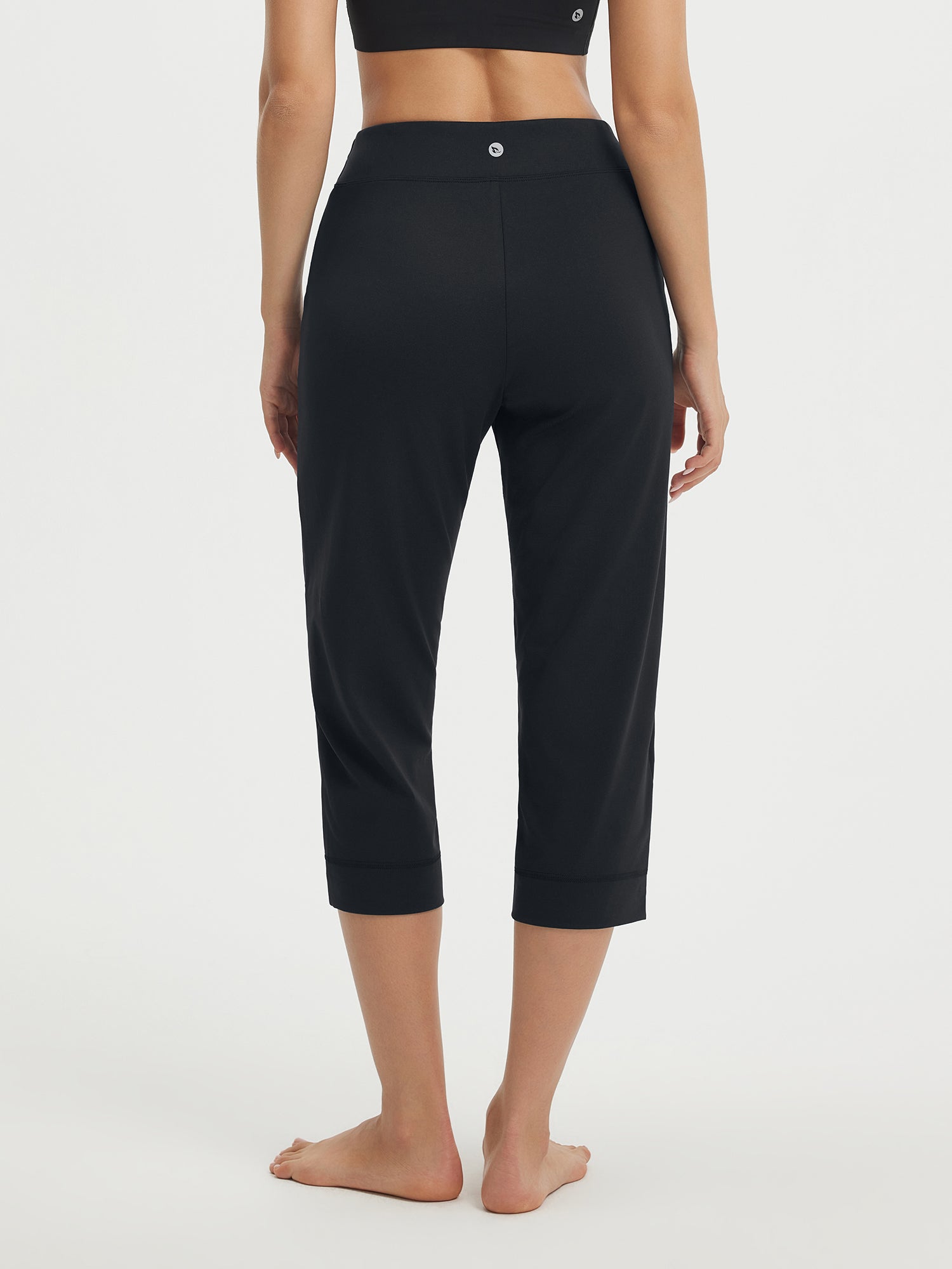 Baleaf Stretchy High-Rise Capri 21" in black, back view of straight-leg silhouette. #color_Black
