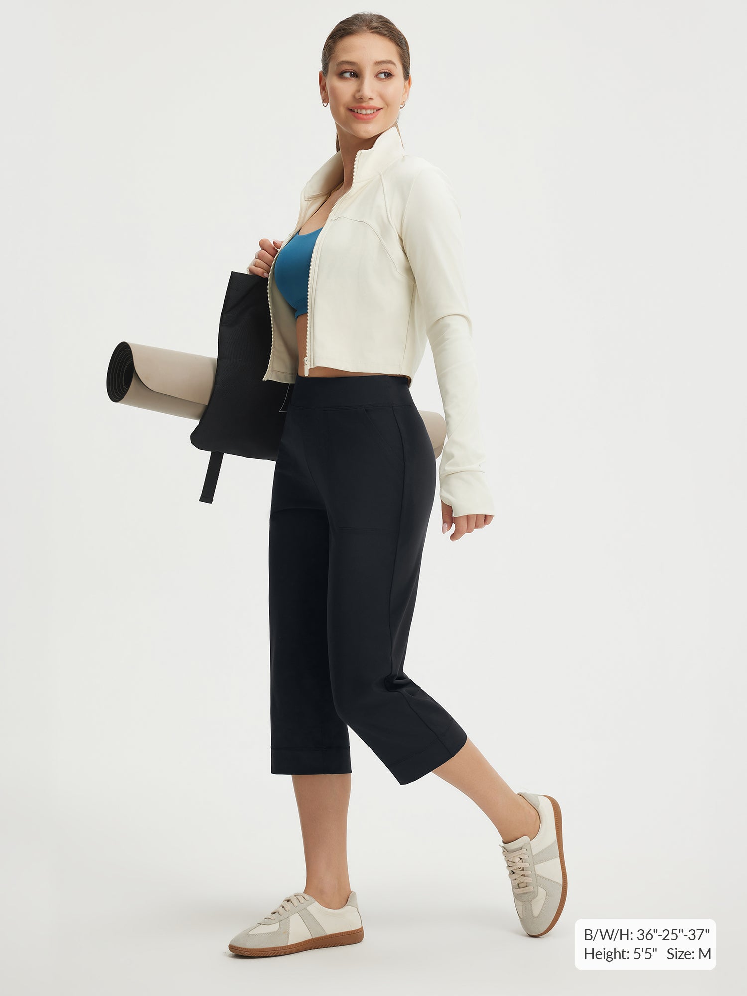 Baleaf 21" black high-rise stretchy capri pants on model #color_Black