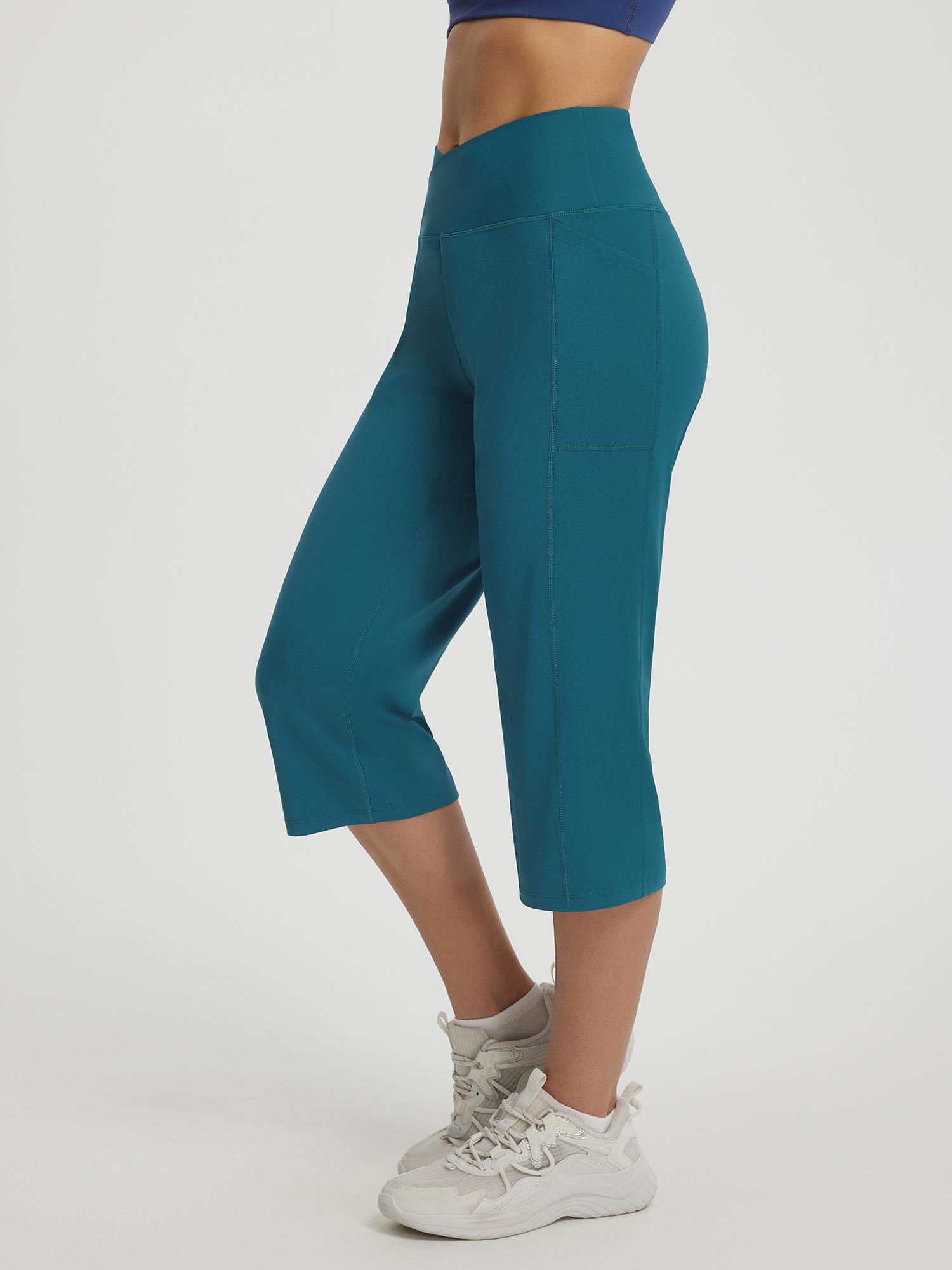 Baleaf V-Cross 18" teal straight leg capri pants with side pockets and high waist #color_Deep Blue