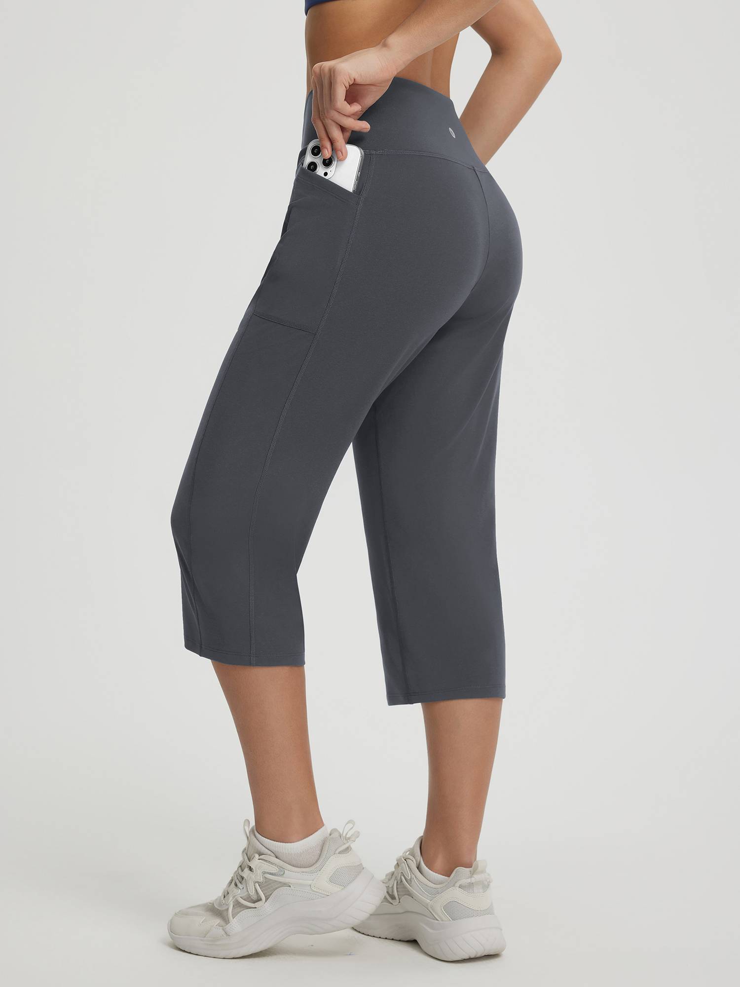 Baleaf women's dark grey 18-inch V-cross straight leg capri pants with phone pocket. #color_Dark Gray
