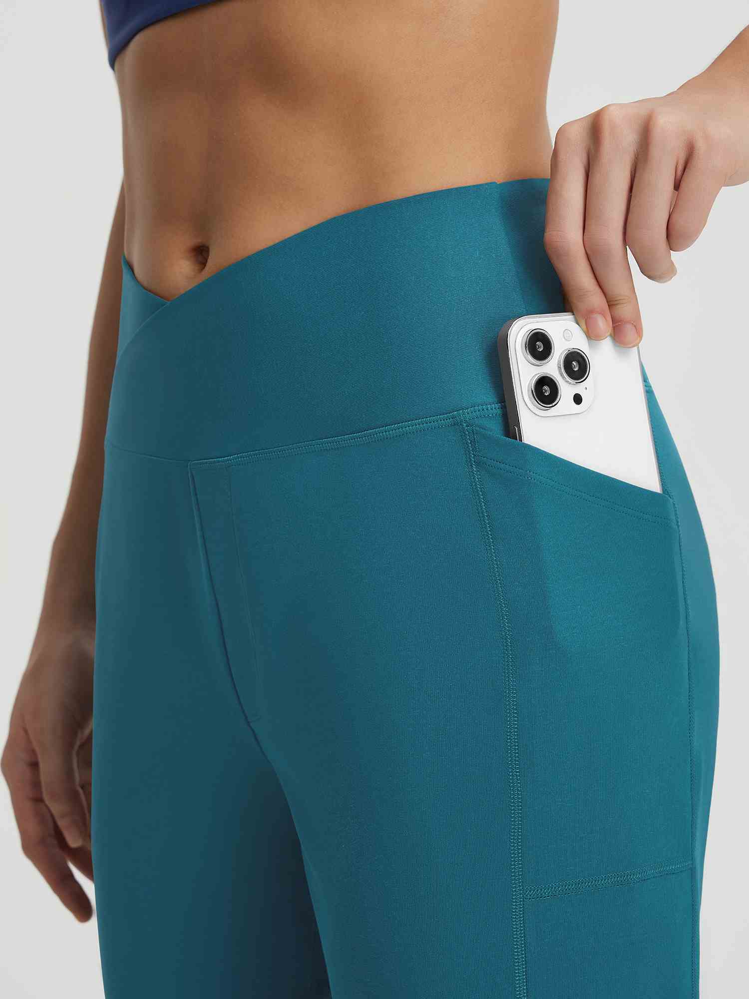 Baleaf teal V-cross capri pants with phone in side pocket. #color_Deep Blue