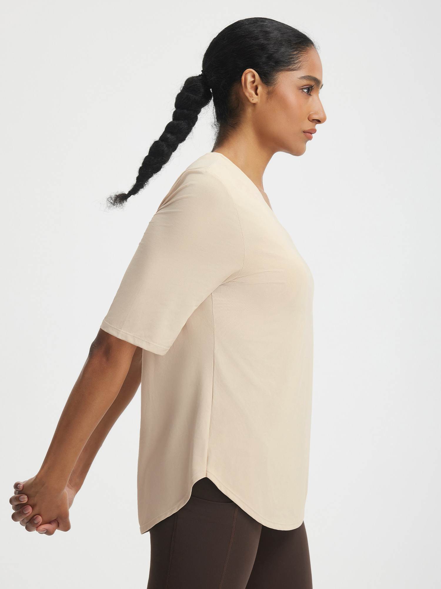Woman wearing Baleaf UPF 50+ V-neck half sleeve athletic shirt in light beige. #color_Beige
