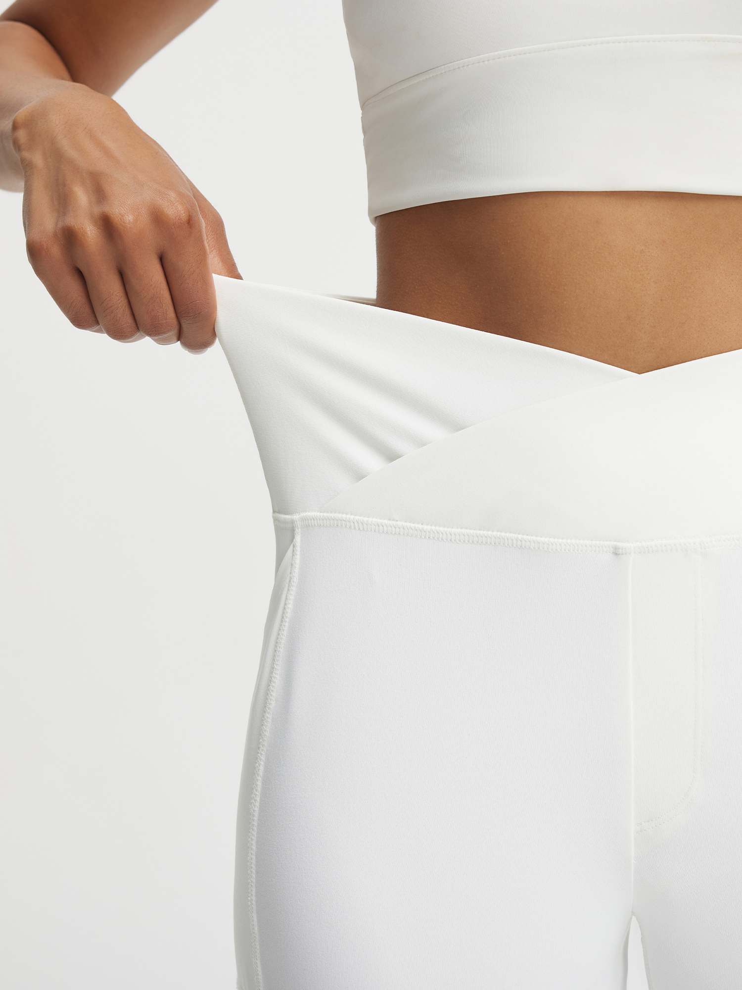 Baleaf white V-waist 9" Bermuda long shorts showing ultra-soft stretch fabric #color_White