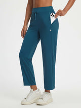 Baleaf high-rise 25" teal pants featuring dual zipper pockets, one holding a phone. #color_Deep Blue