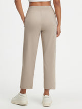 Baleaf ultra-soft high-rise 25" pants in beige, back view, with zipper pockets. #color_Khaki