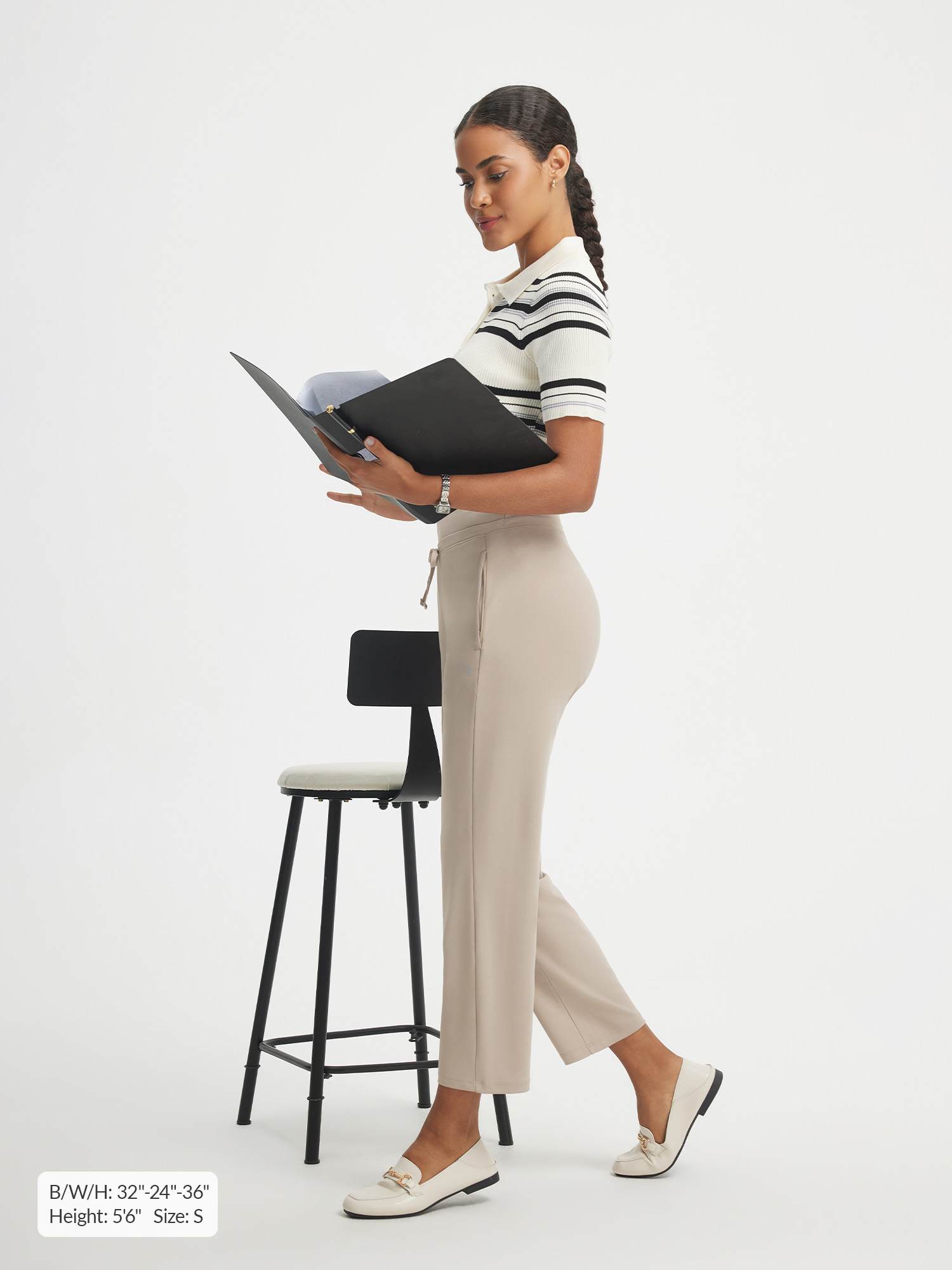 Woman in beige Baleaf ultra-soft 25" high-rise pants with zipper pockets. #color_Khaki