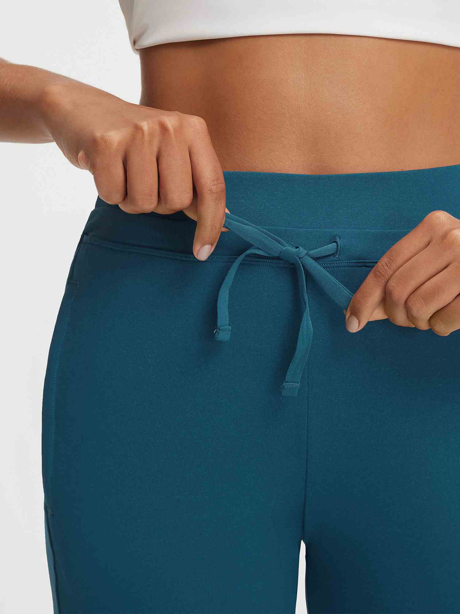 Baleaf ultra-soft high-rise teal 25" pants showing adjustable drawstring waistband tied #color_Deep Blue