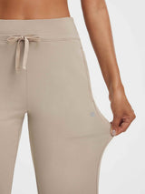 Baleaf beige ultra-soft high-rise pants with drawstring waist, showing flexible fabric stretch. #color_Khaki