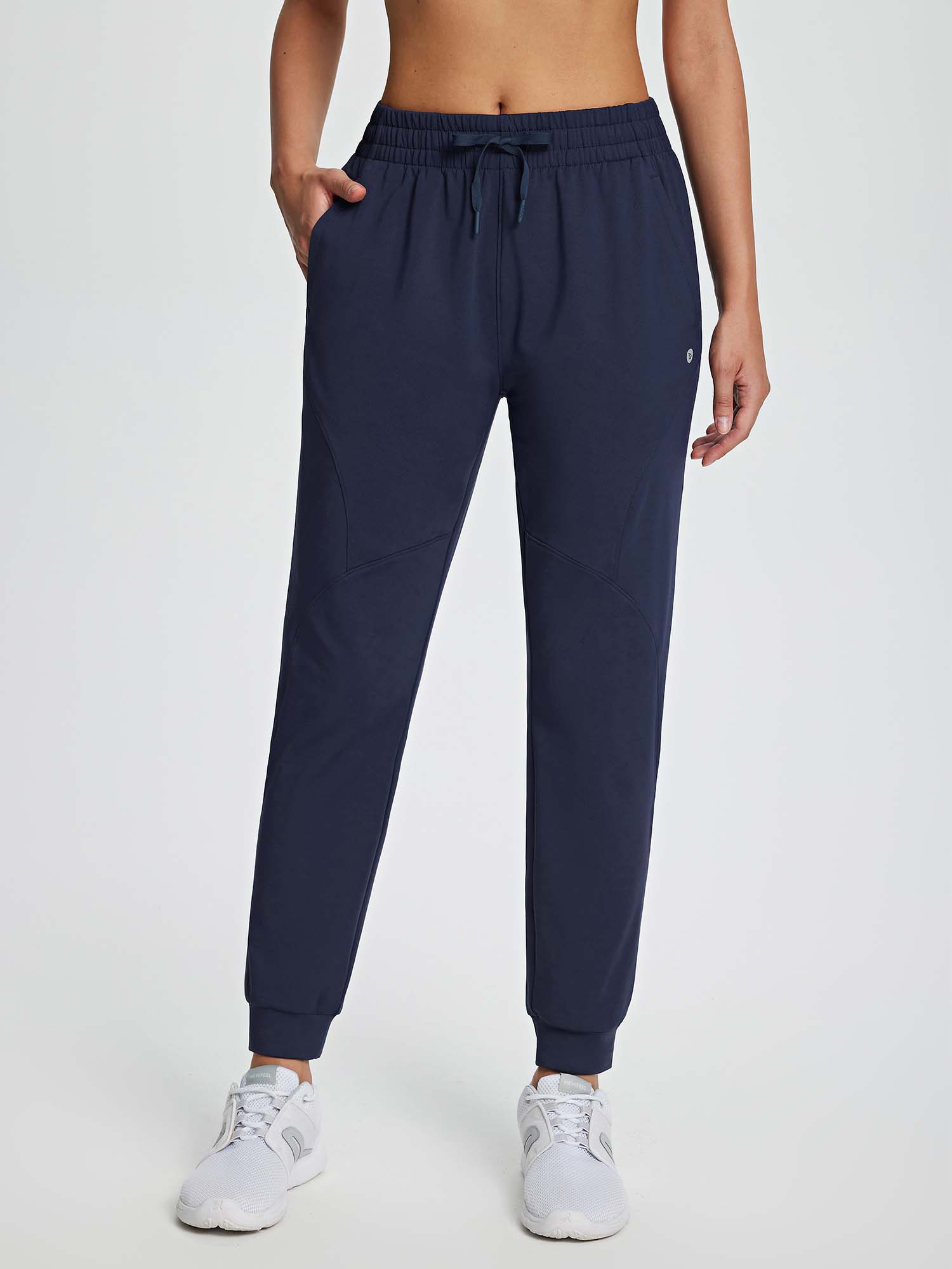 Women's navy drawstring fleece jogger pants with elastic waist and cuffed ankles. #color_Navy Blue