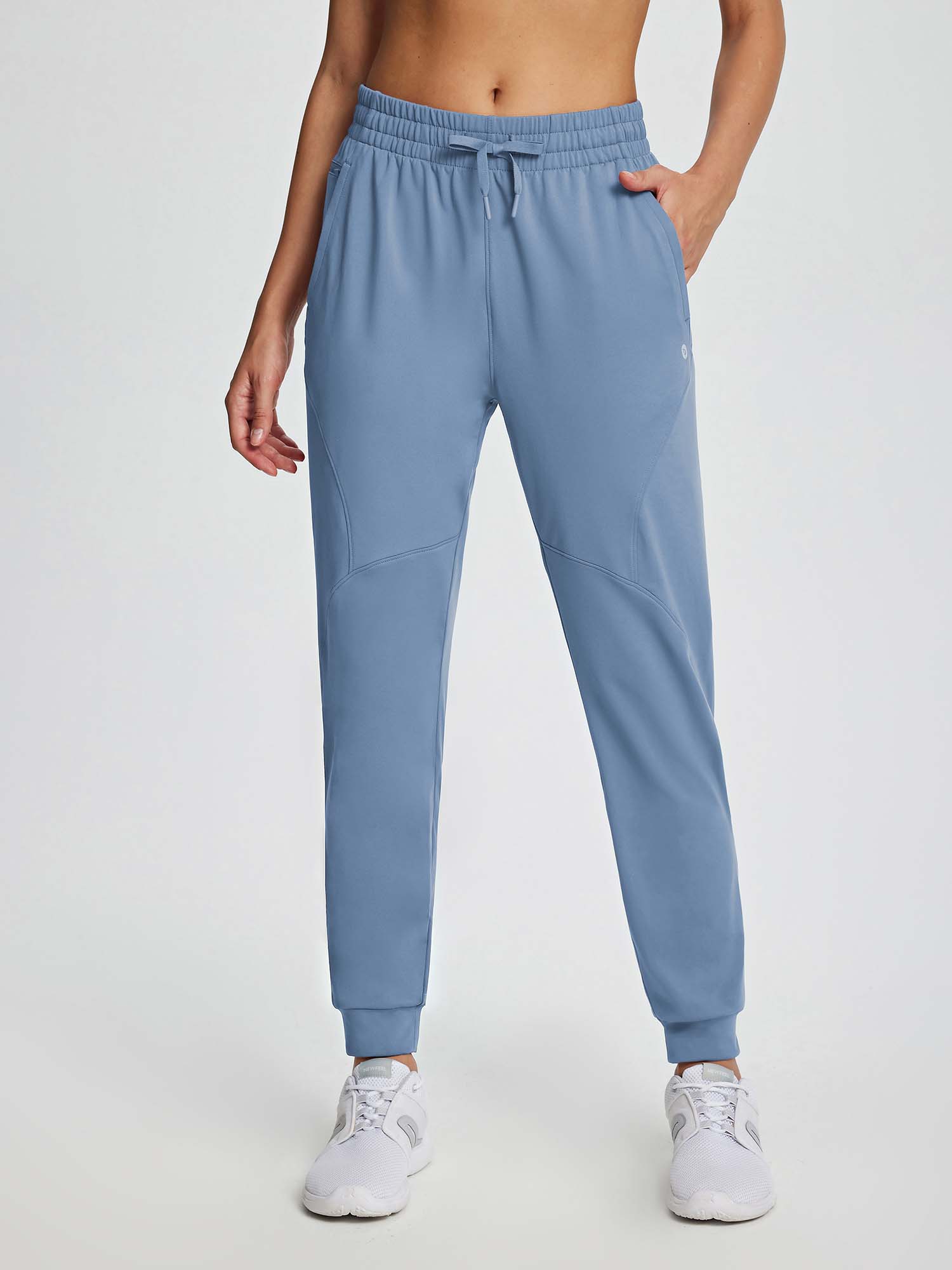 Women's blue drawstring fleece jogger pants featuring elastic waistband and side pockets. #color_Light Blue