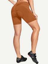 Burnt orange women's V-waist cycling shorts, 5.1" inseam, 4D gel padding, side pockets.