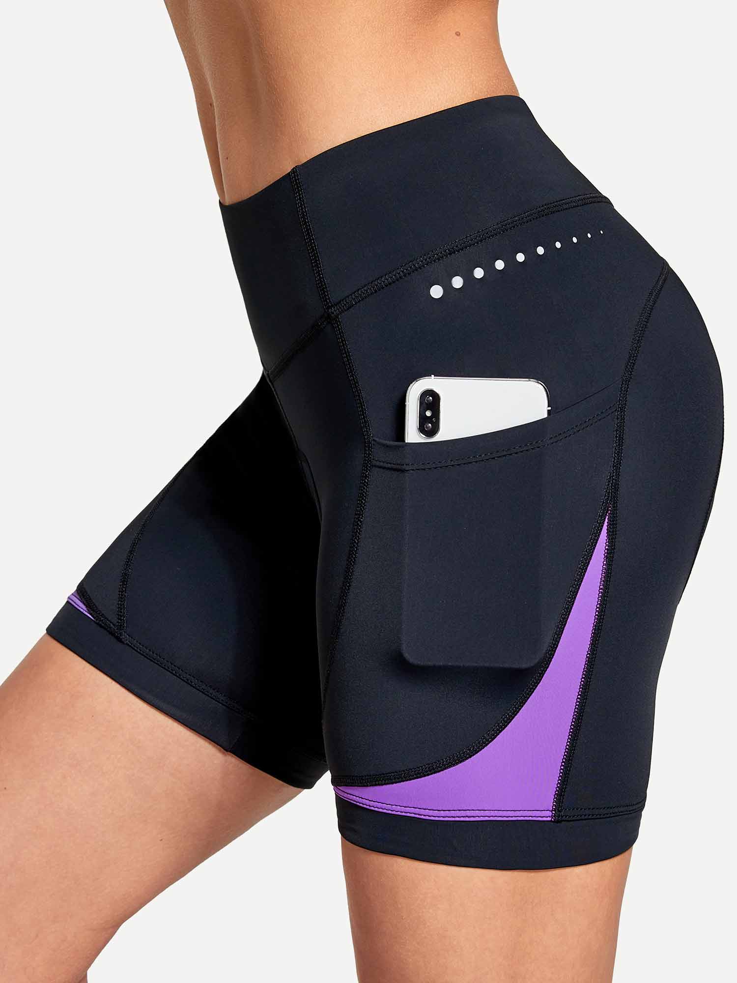 Women's black V-waist cycling shorts with side phone pocket, purple accent, and reflective dots. #color_Purple