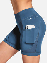 Women's blue V-waist cycling shorts with phone pocket and mesh detail. #color_Navy Blue