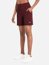 Dark red Laureate 3-pocket athletic shorts with white logo, high rise waist, and side pockets. #color_Chocolate Truffle
