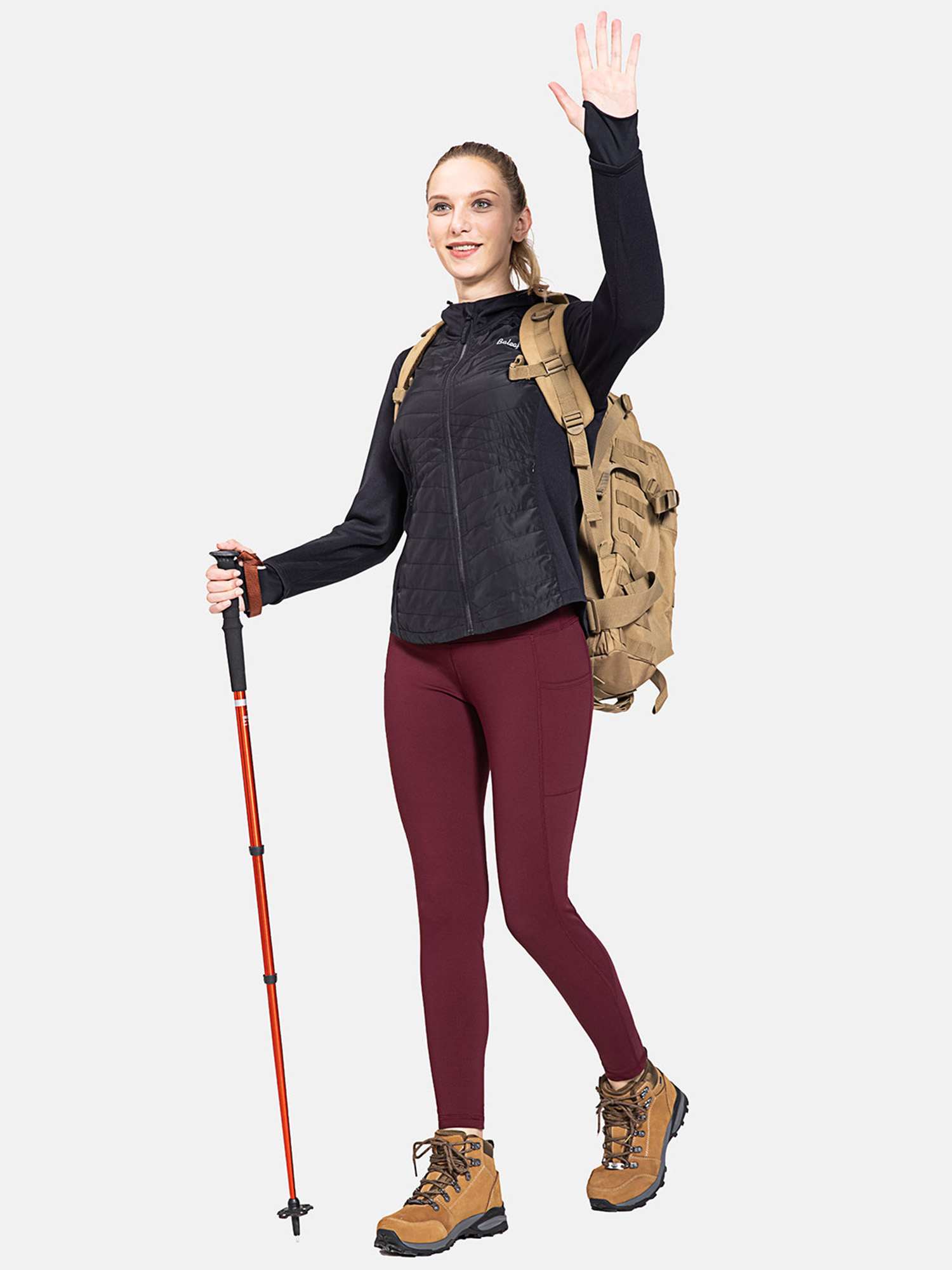 Burgundy high-waisted brushed fleece leggings with pockets, worn by a woman for outdoor activities. #color_Wine Red