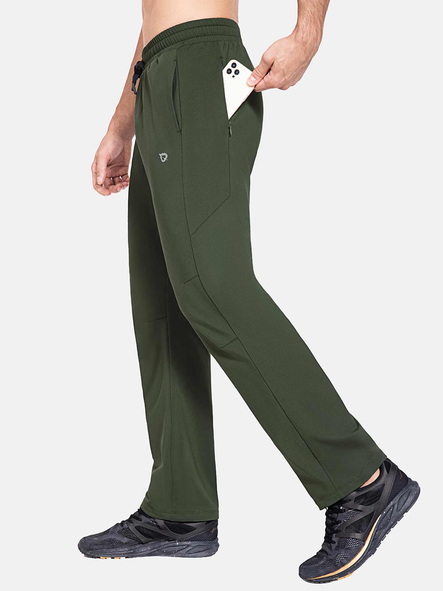 Man putting smartphone in side zipper pocket of Baleaf army green fleece lined pants