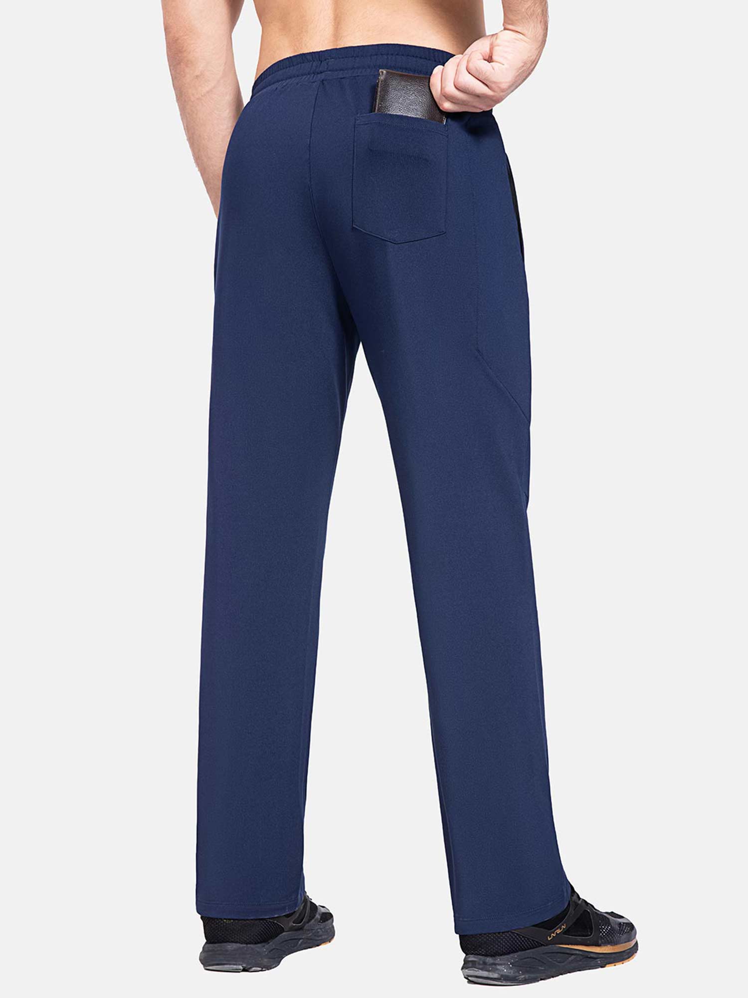 Men's navy fleece-lined straight leg athletic pants, back pocket holding wallet #color_Navy Blue