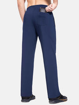 Men's navy fleece-lined straight leg athletic pants, back pocket holding wallet #color_Navy Blue