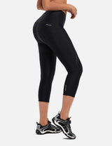 Women's black BALEAF padded cycling capris, high-waisted, 3/4 length, with reflective details. #color_Black