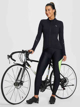 Women's black padded cycling tights with lime green colorblock and reflective details. #color_Fluorescent Green