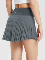 Grey women's high-waisted athletic pleated running skirt with zippered pocket. #color_Lavender Gray
