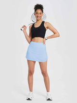 Women's light blue high-waisted pleated running skirt with A-line silhouette.