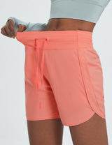 Women's coral quick-dry running shorts with 5" inseam, high waist, drawstring, and side pockets. #color_Pink