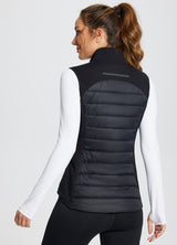 Black slim-fit puffer vest for running, quilted back with reflective detail, women's view. #color_Black