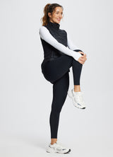Running slim-fit puffer vest for women, black, active lifestyle model