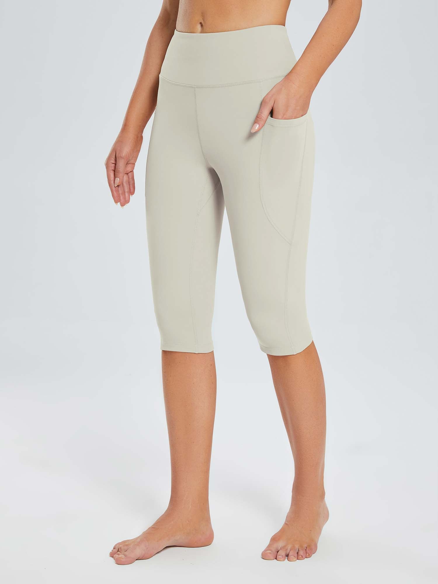 Laureate women's light beige pocketed yoga capris with high waist and side pockets. #color_Light Brown