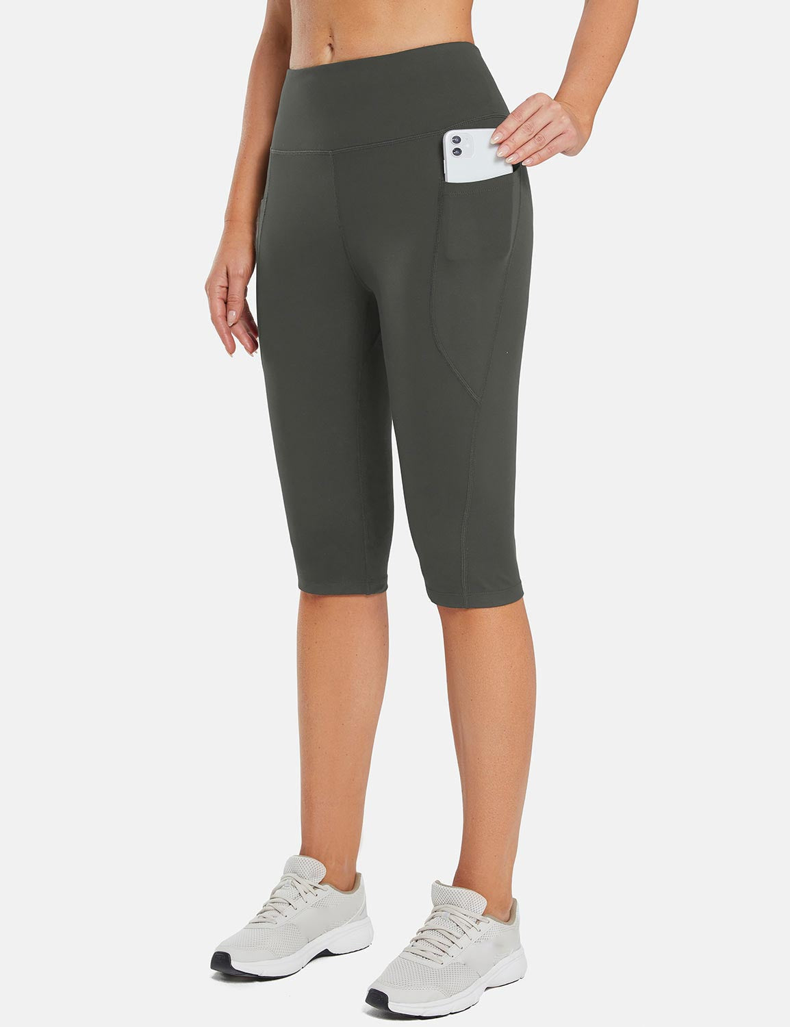Laureate women's dark grey pocketed yoga capris with phone in side pocket. #color_Dark Gray